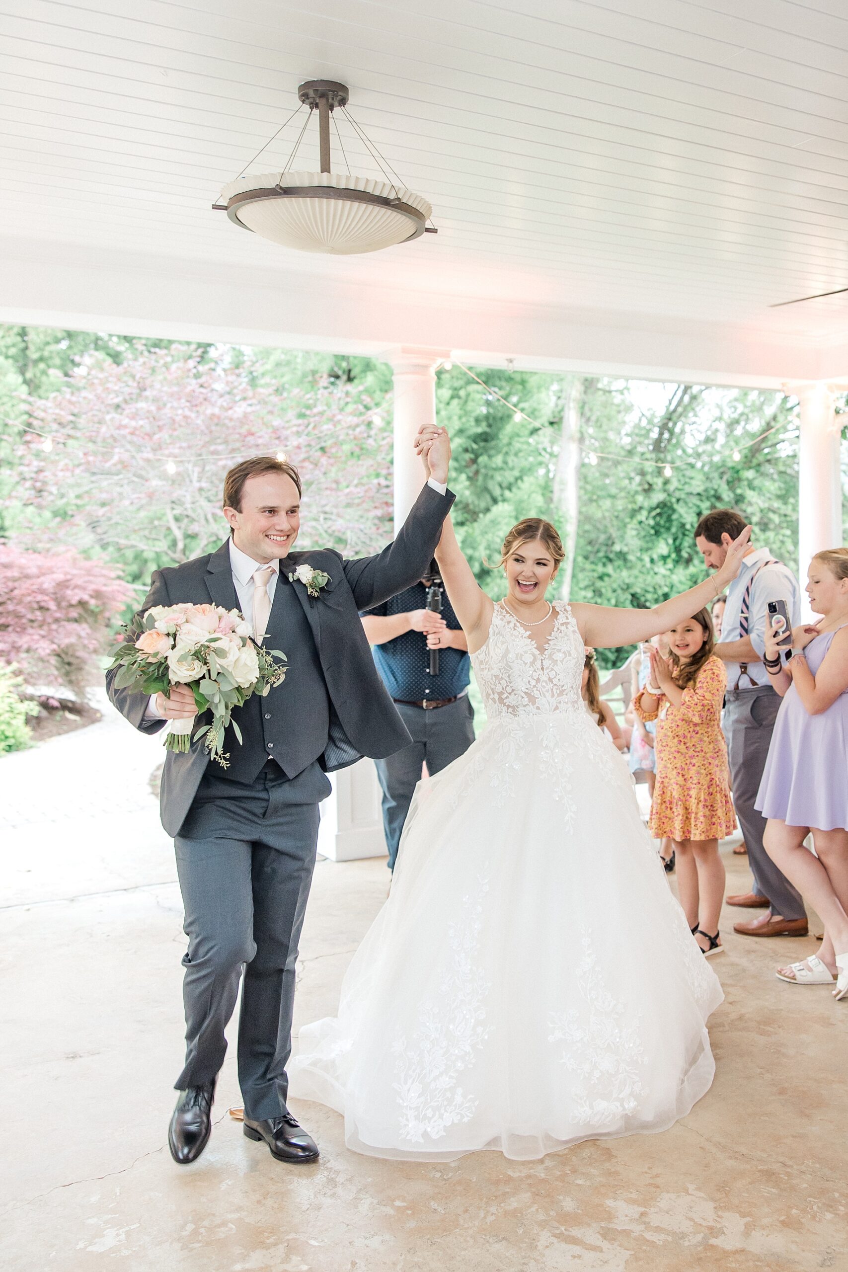 newlyweds enter wedding reception