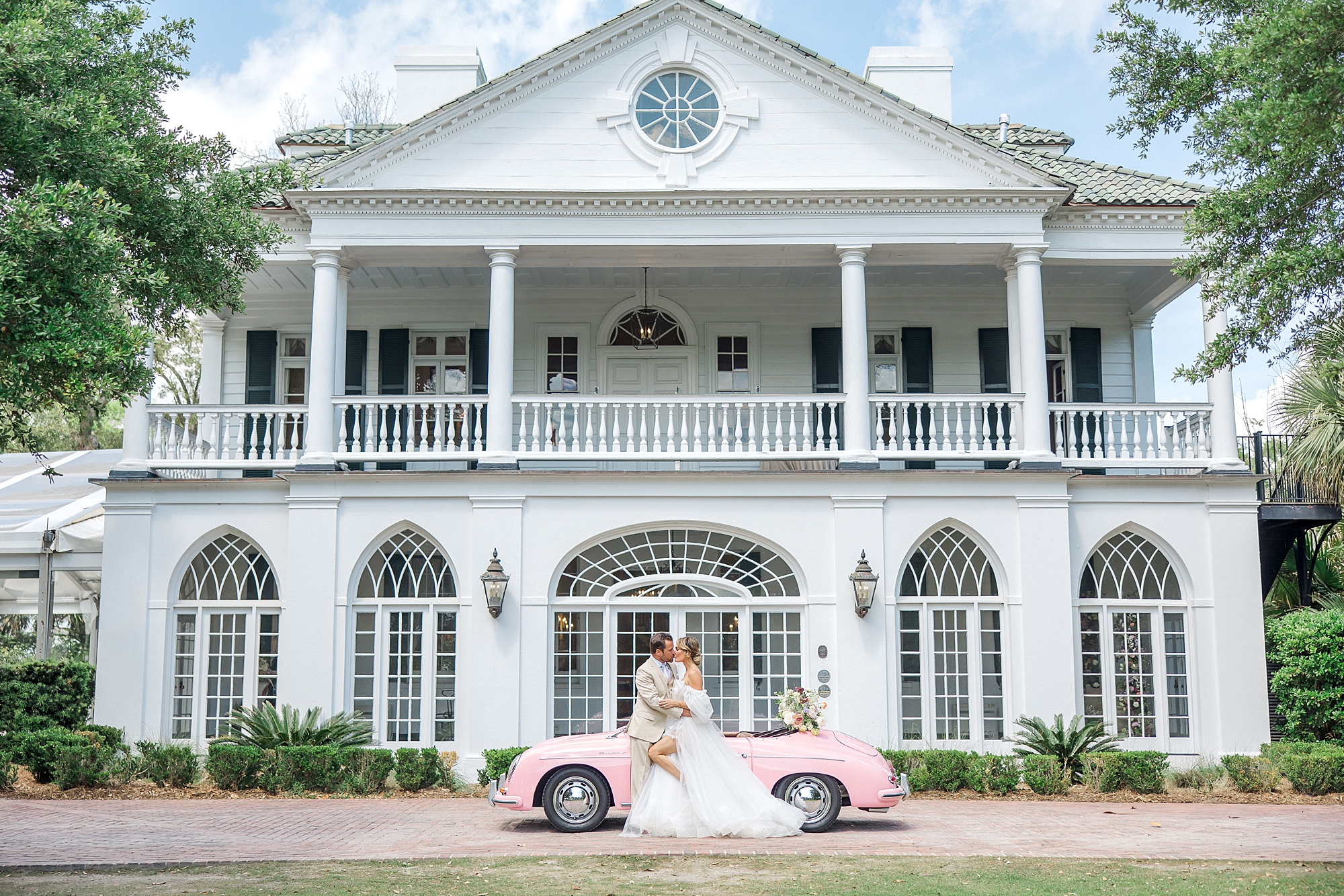 bride and groom with pink vintage Porsche