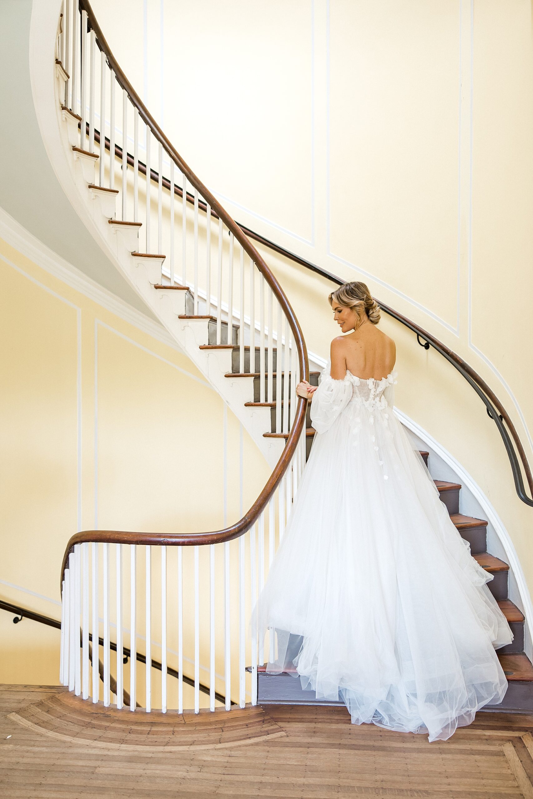 bride walking down grand staircase at Lowndes Grove