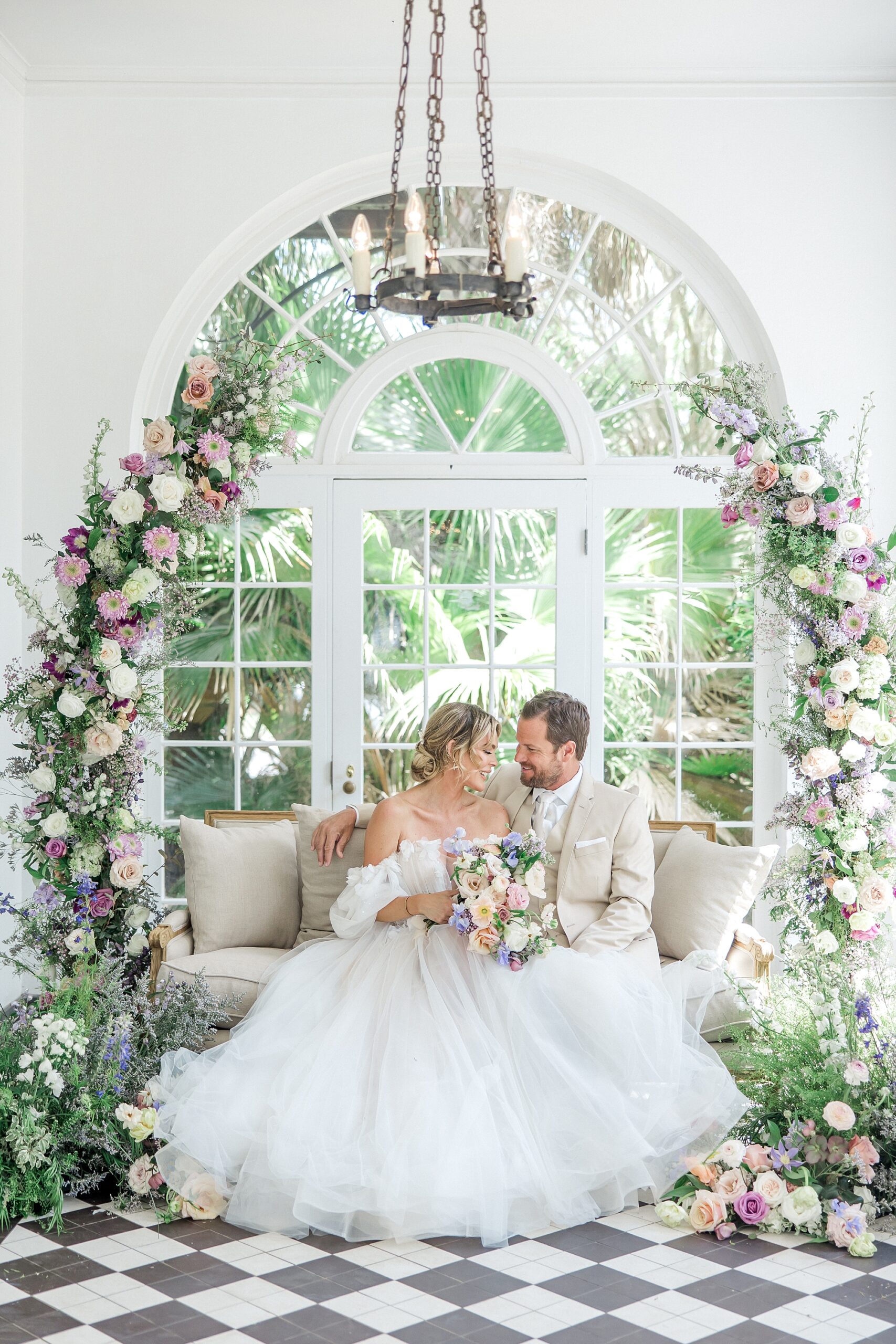 bride and groom portraits surrounded by flowers