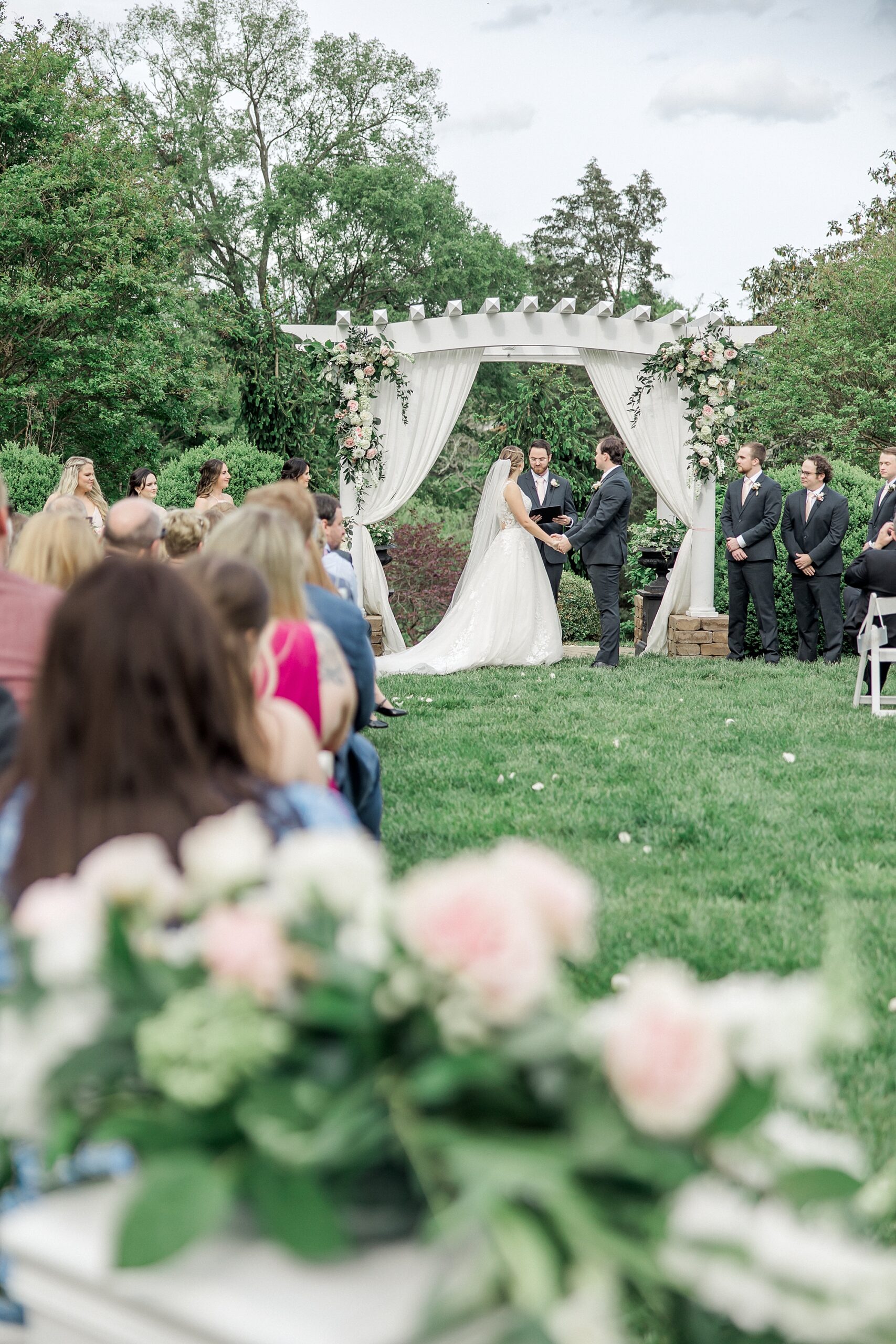 bride and groom hold hands during Sunnybrook Wedding ceremony