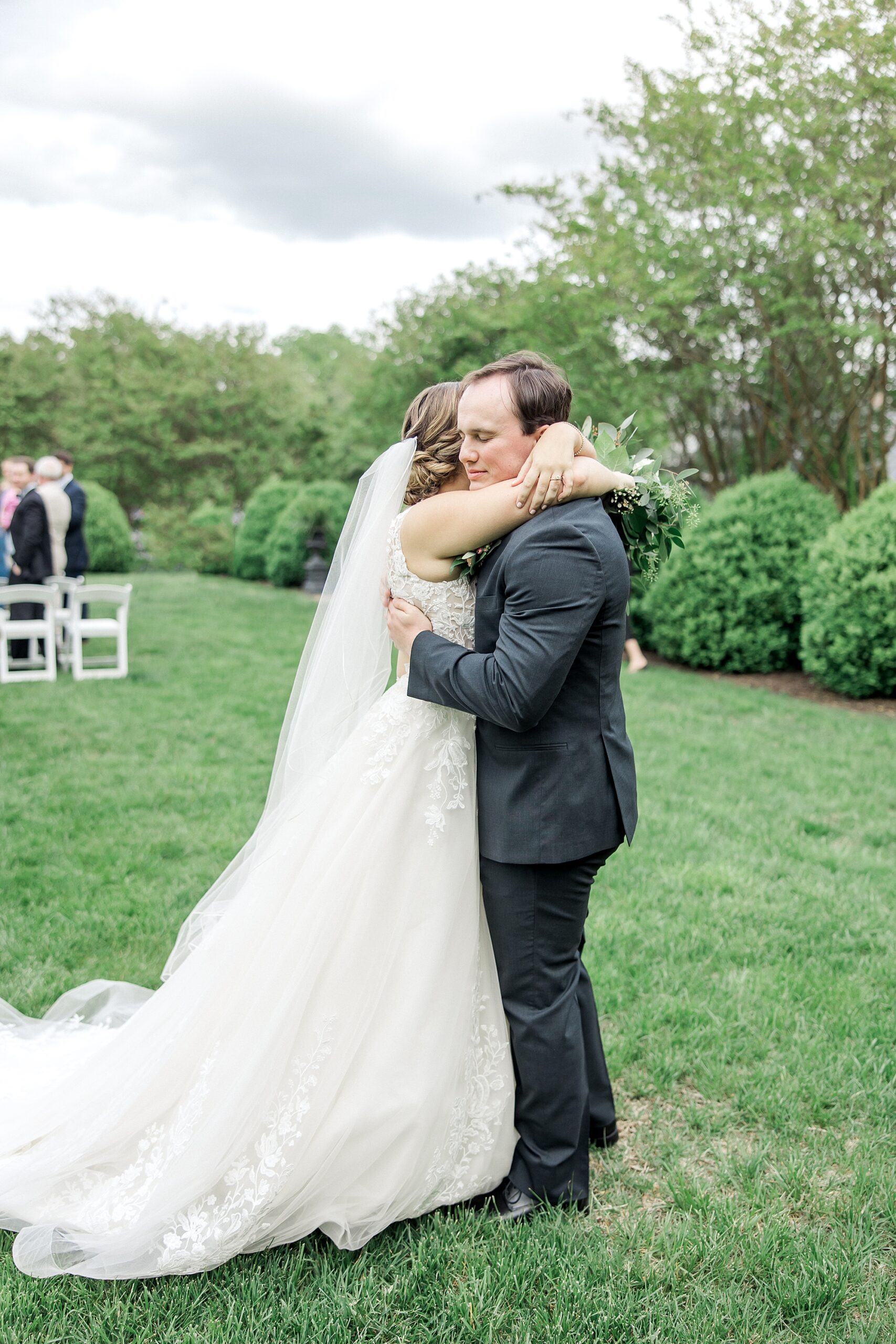 couple embrace after wedding ceremony