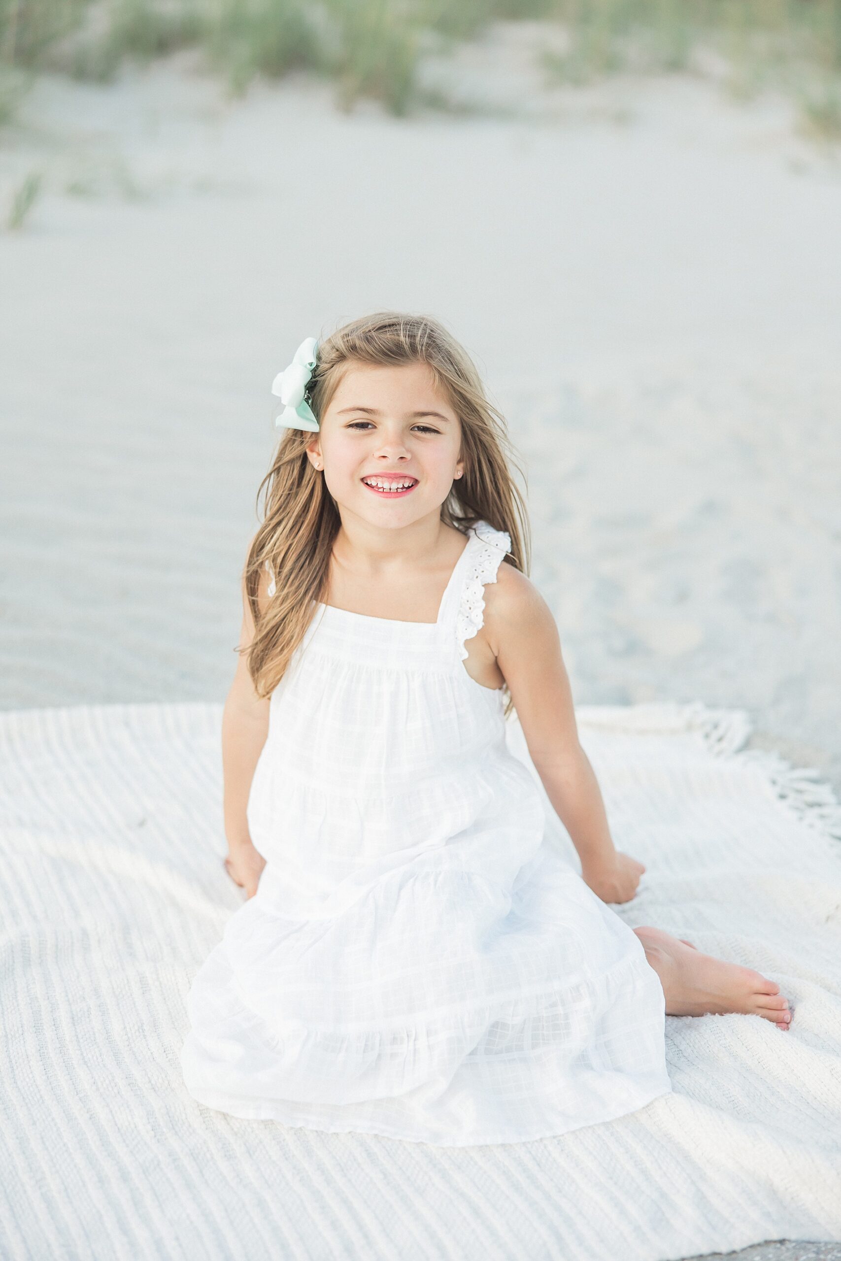 little girl on beach during family session