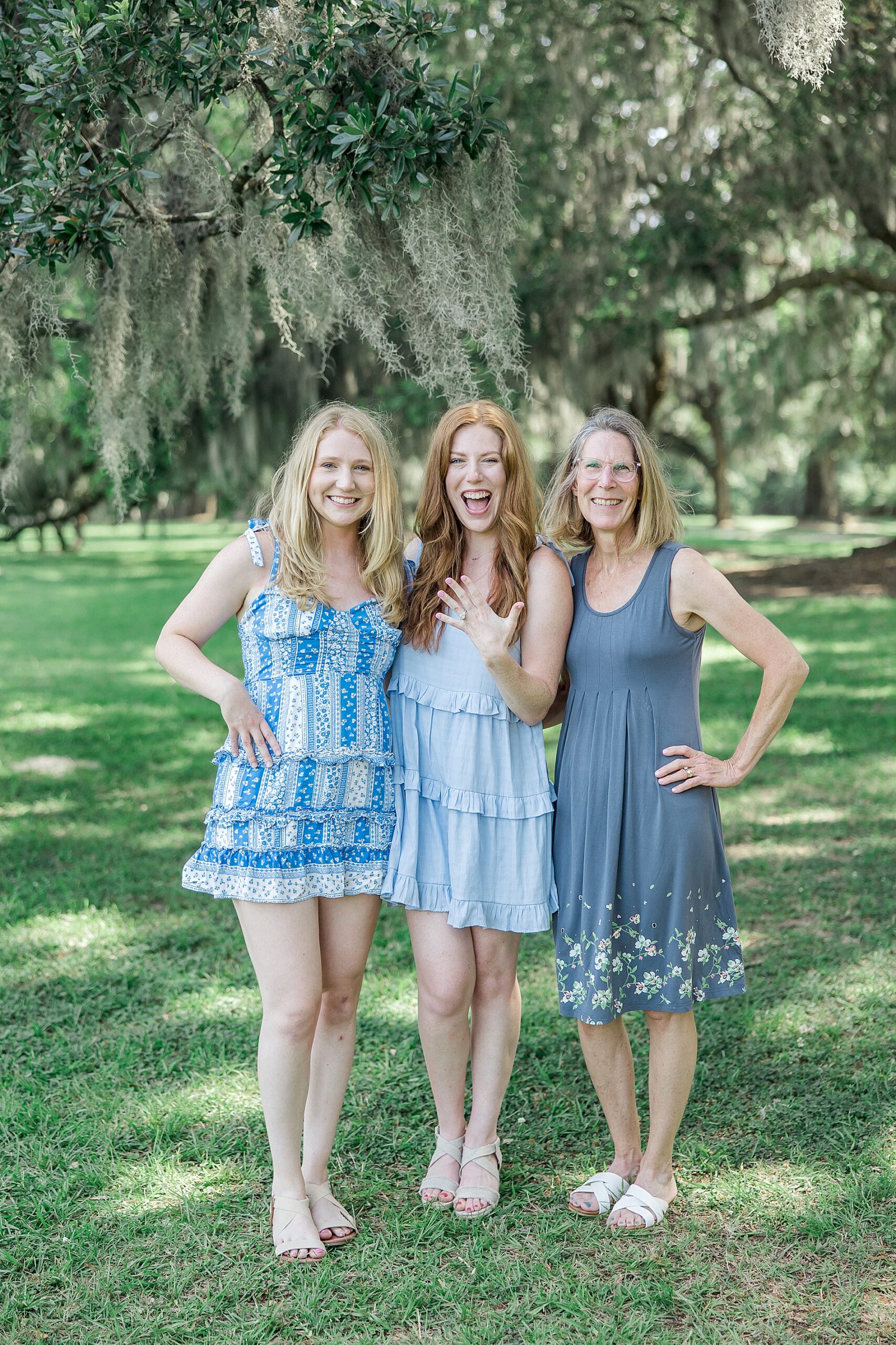 woman with her sisters after Romantic Surprise Proposal at Boone Hall