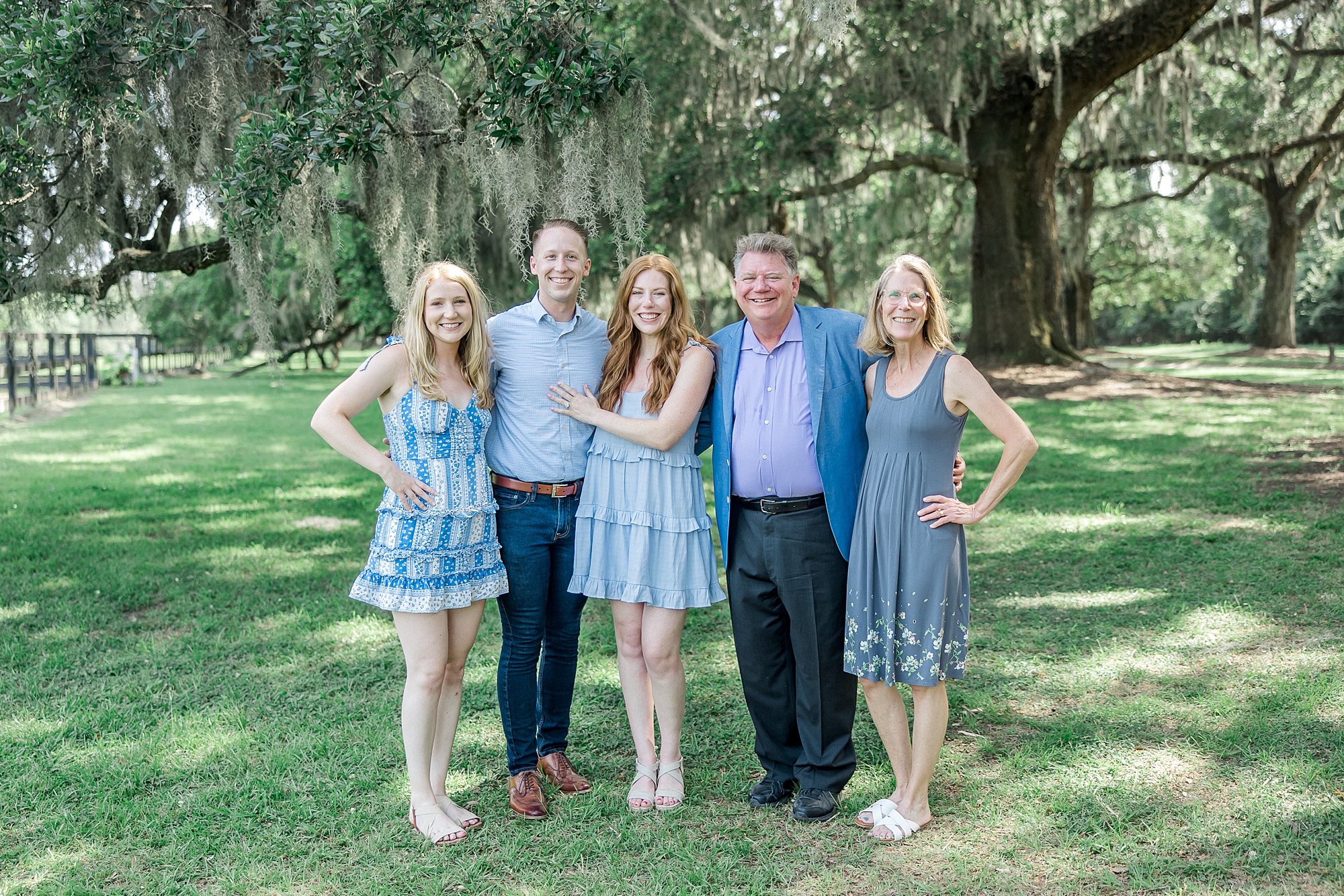 family with couple after Romantic Surprise Proposal at Boone Hall