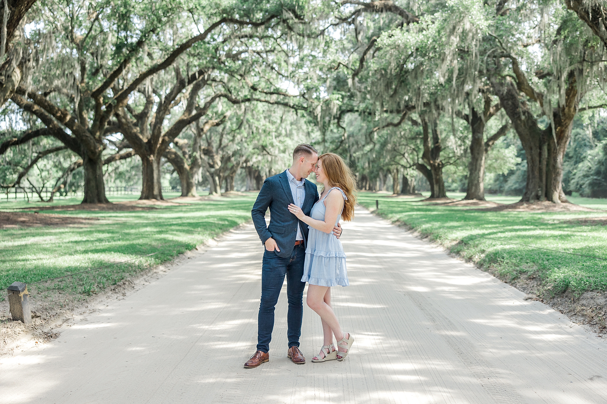 couple under Spanish Moss covered live Oaks