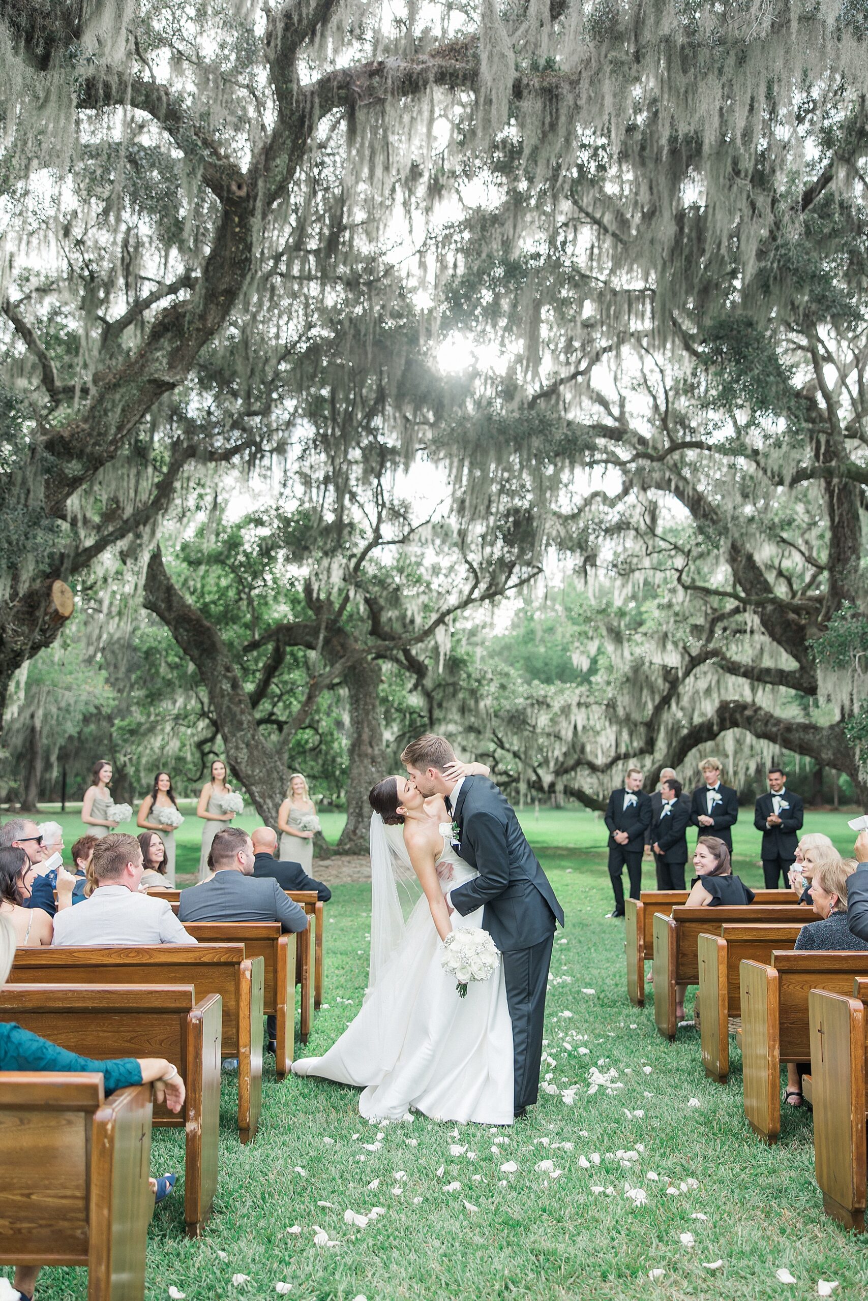 newlyweds kiss as they exit ceremony