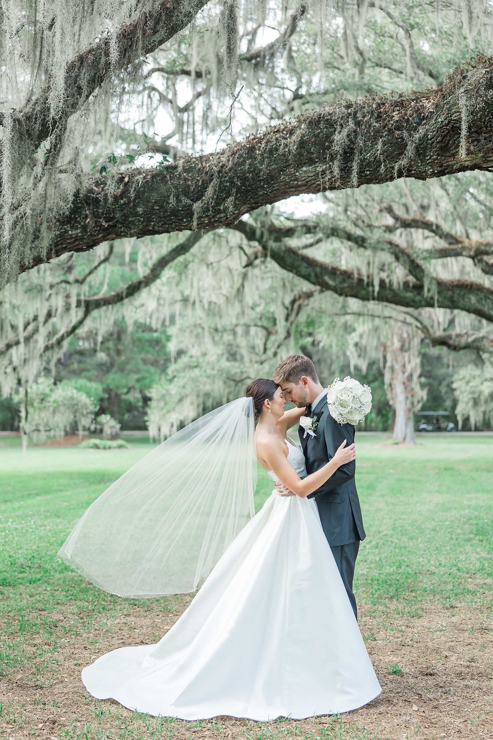 romantic wedding portraits under oak tree