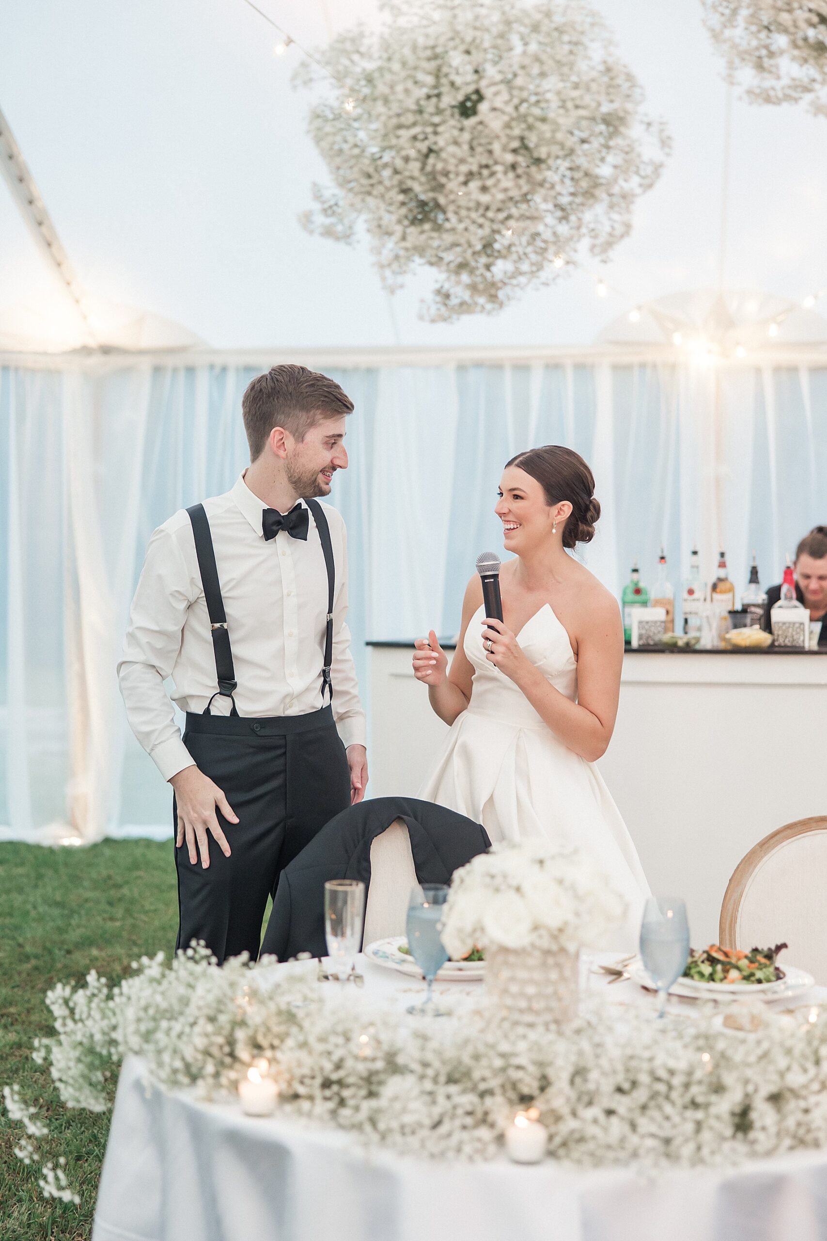 bride and groom say a few words at wedding reception