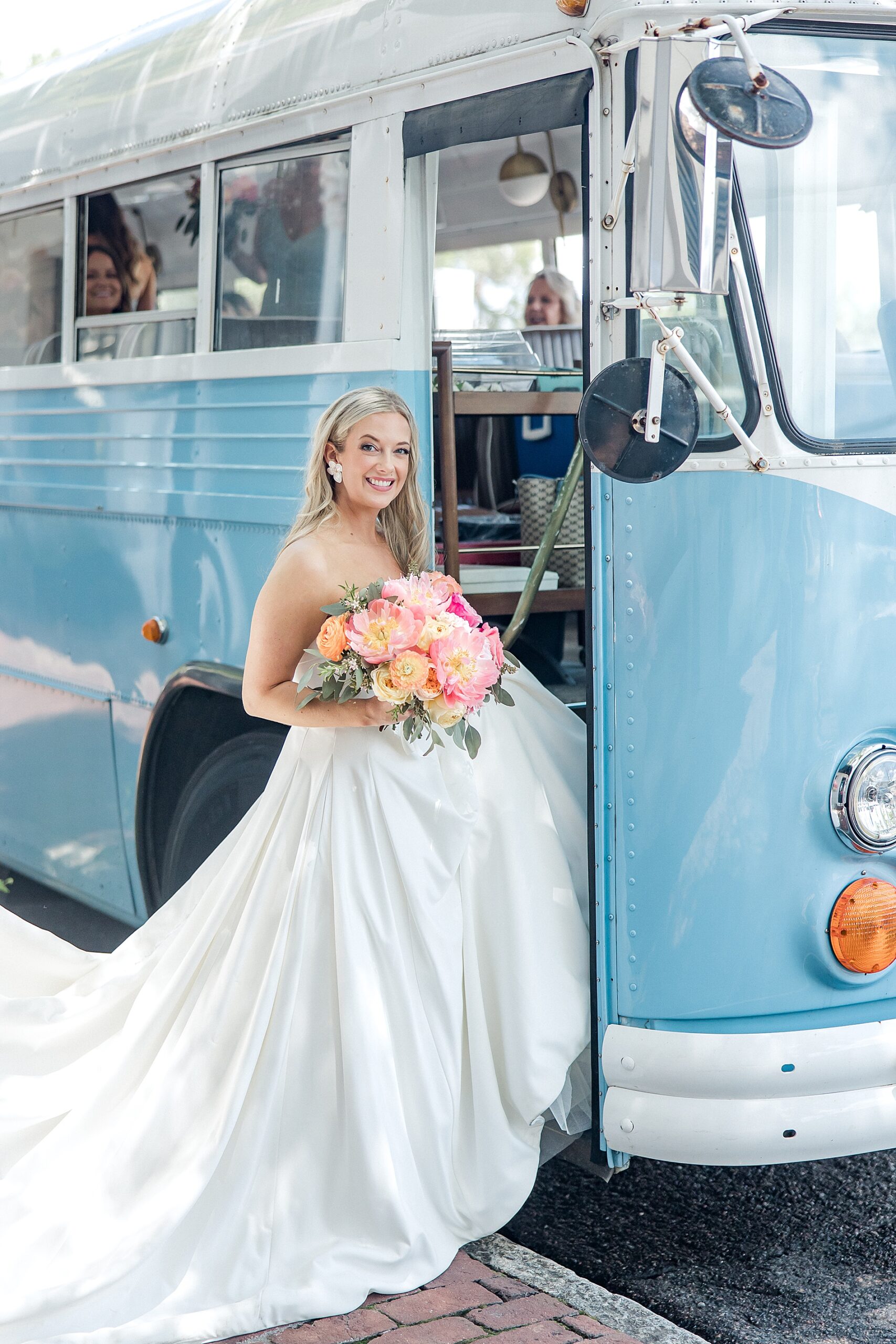 bride getting on bus to go to ceremony