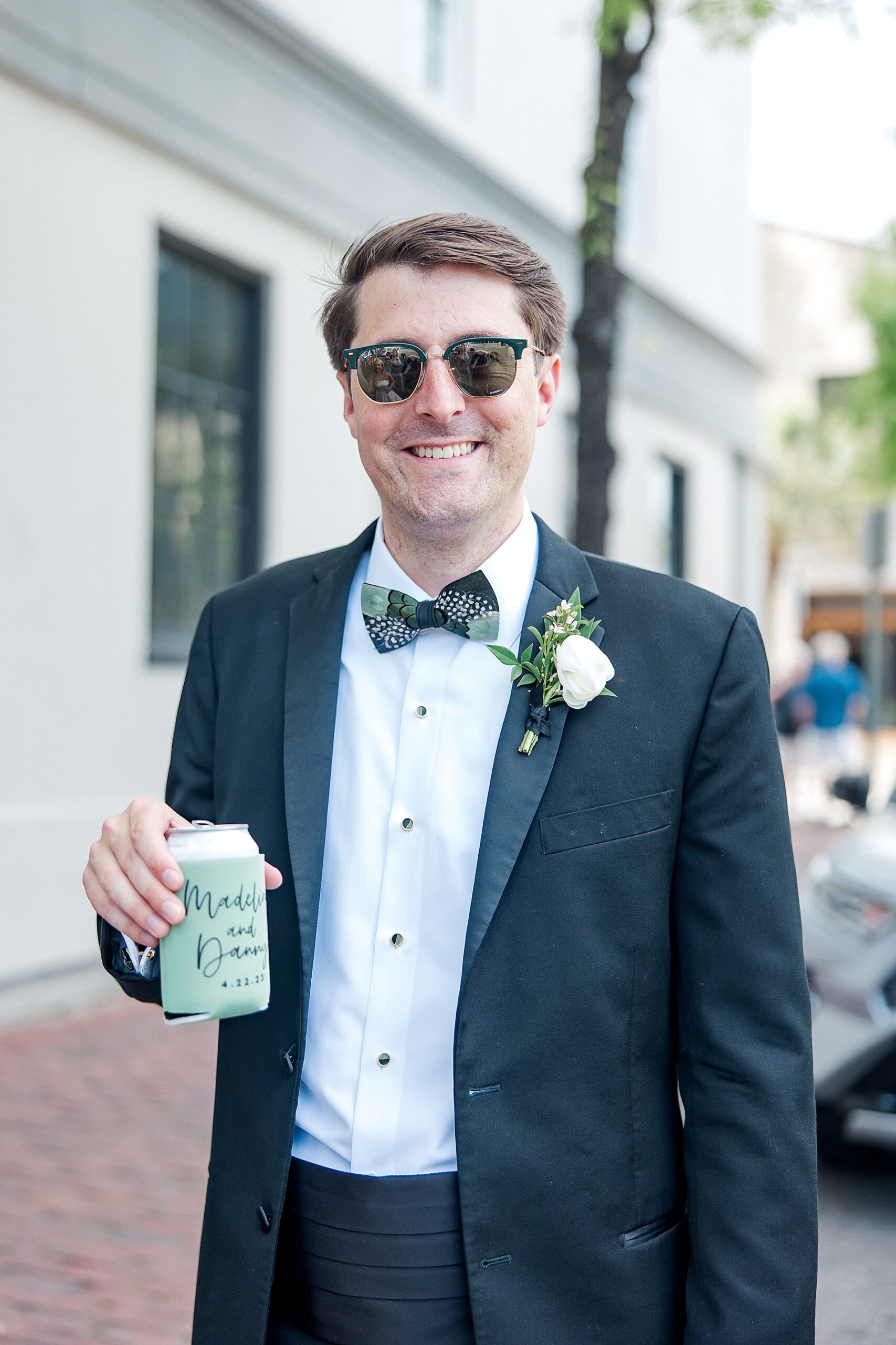 groom in sunglasses during cocktail hour at Hotel Emeline