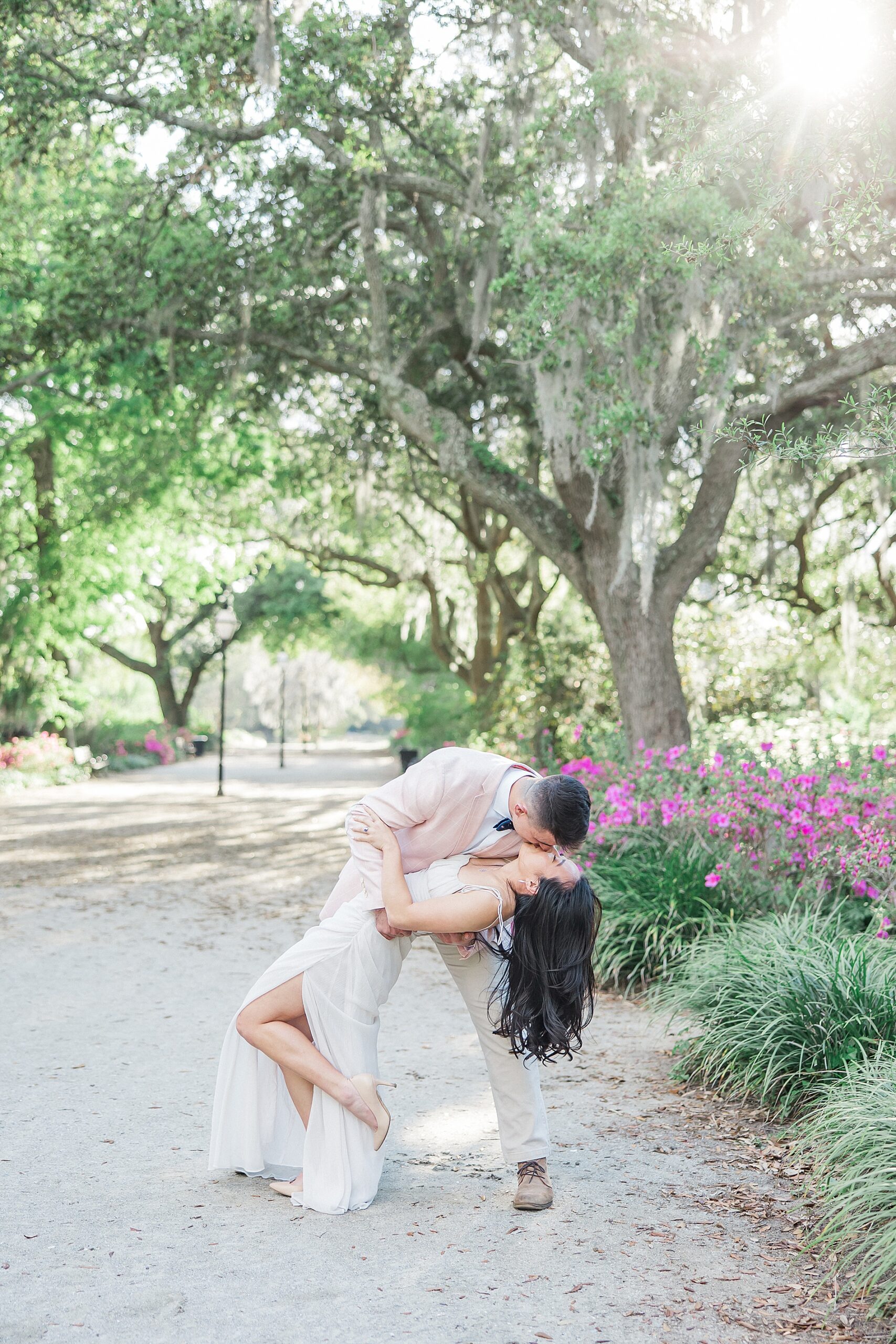 engaged couple kiss during romantic engagement session