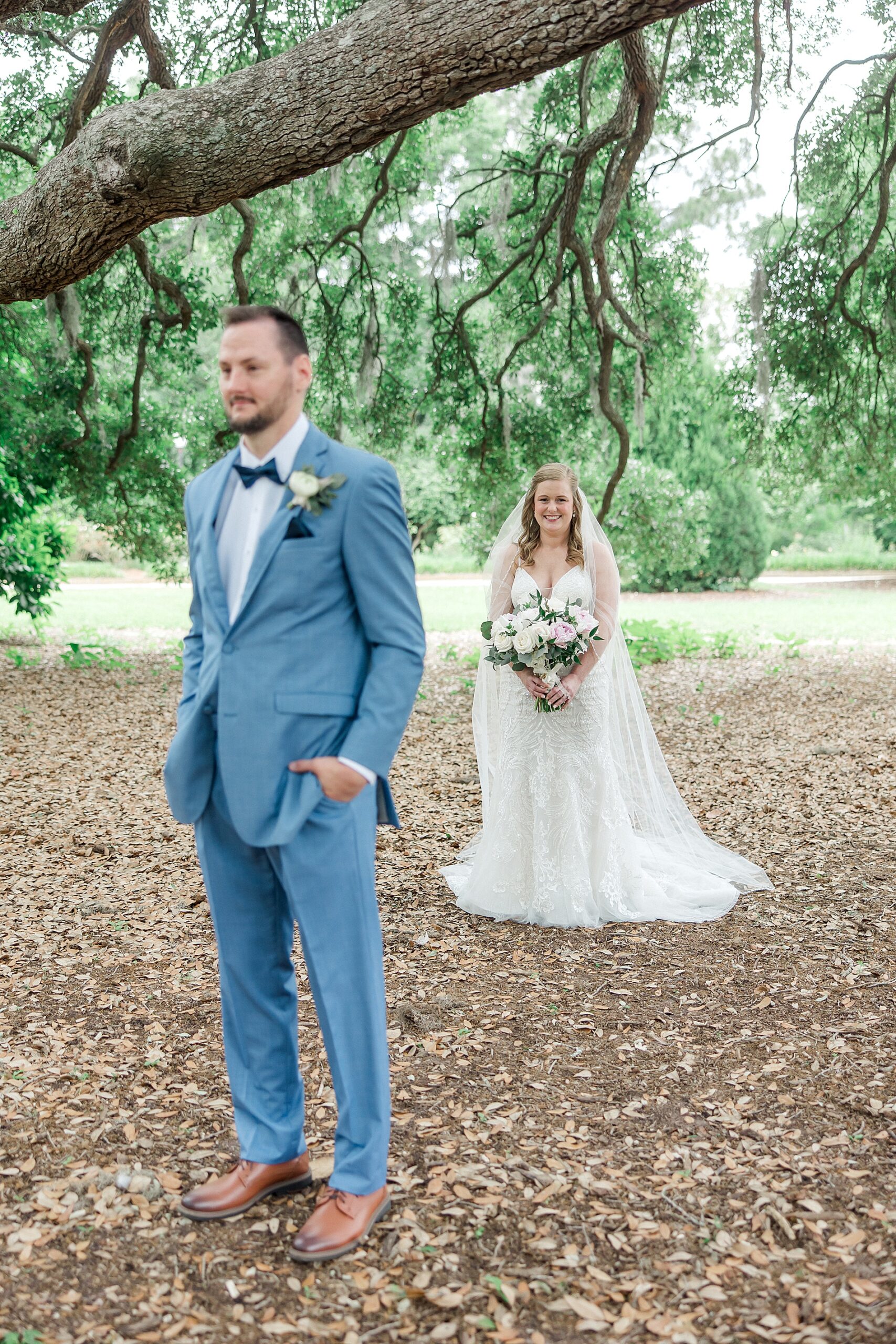 bride approaches groom for first look