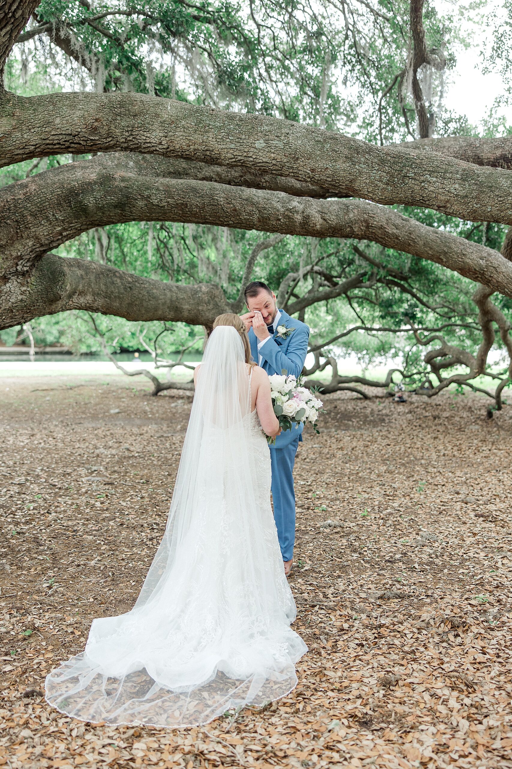 groom wipes away tears