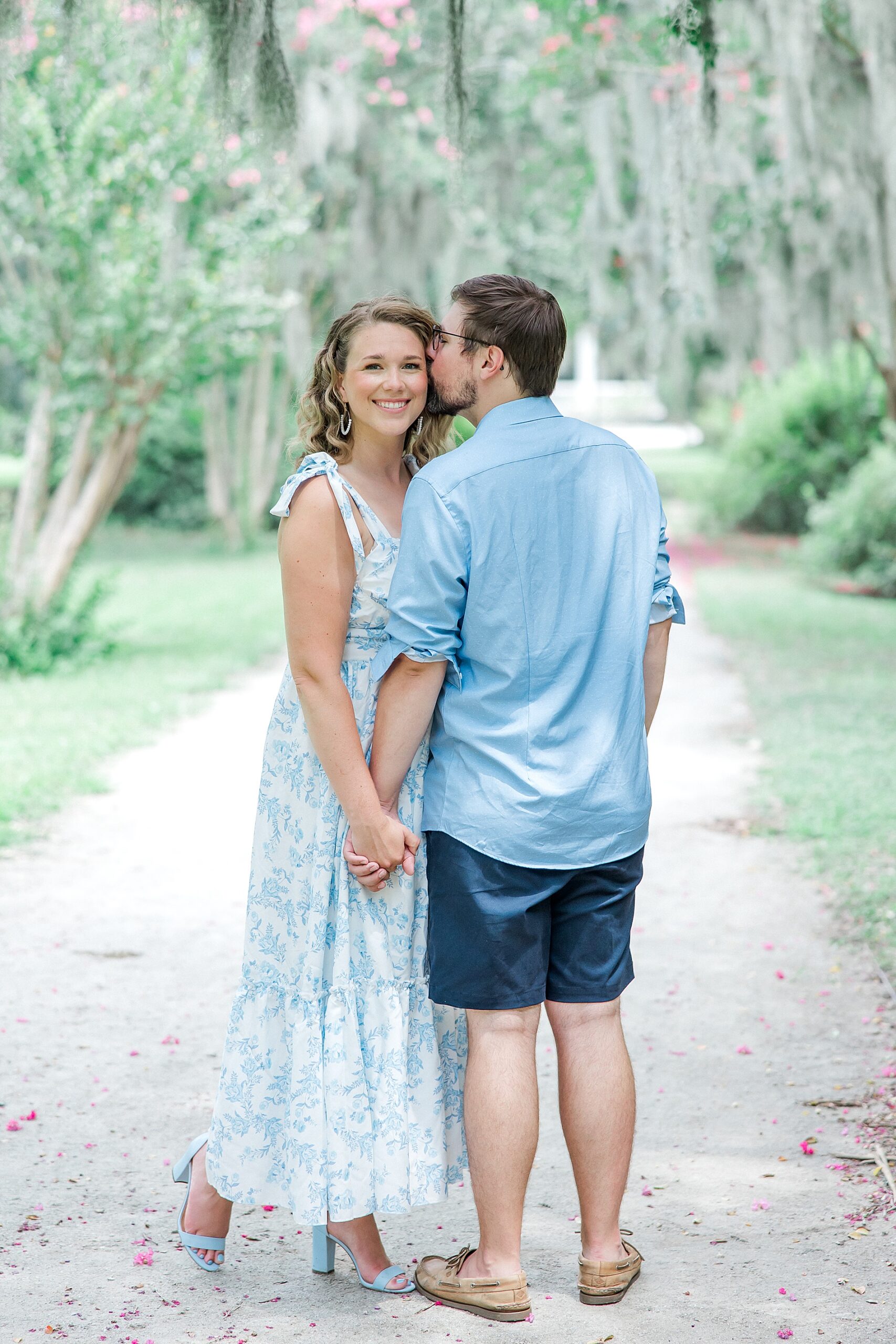 husband kisses his wife's cheek