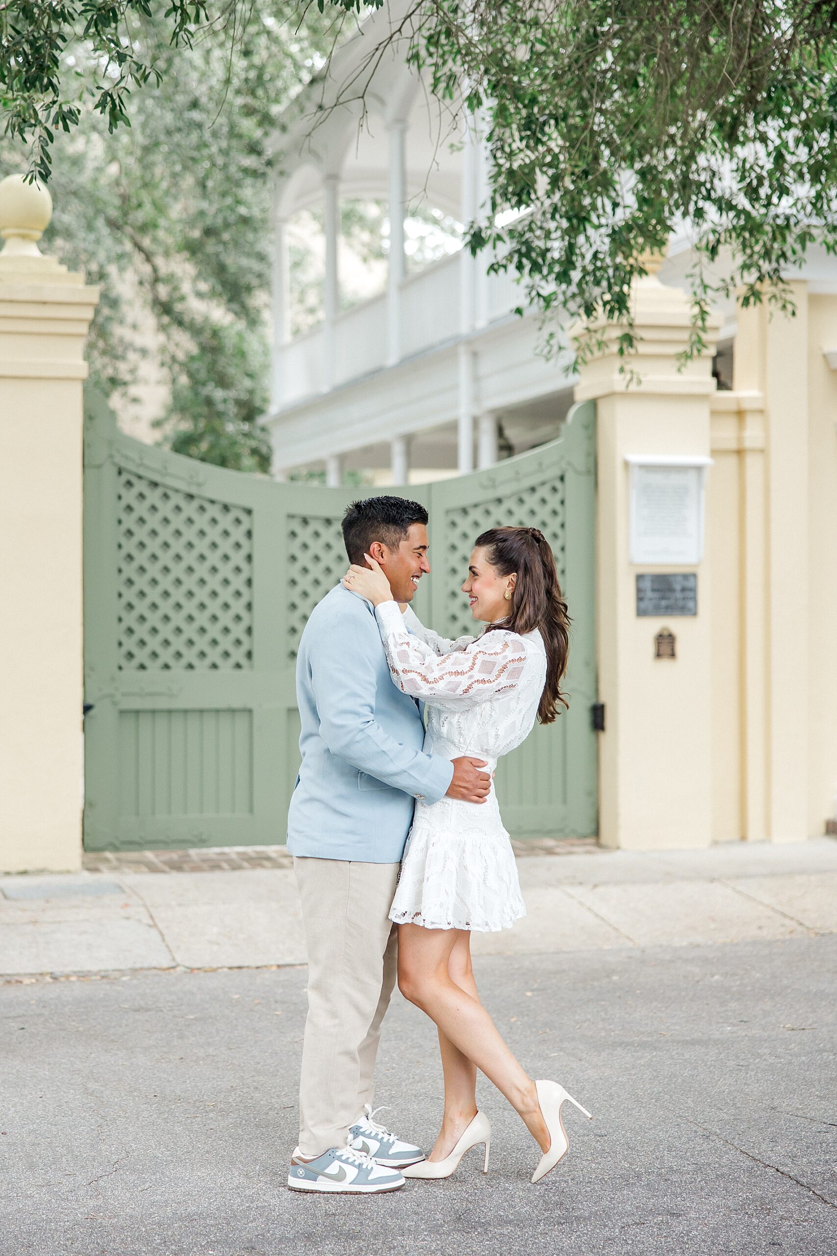 couple in front of beautiful architecture in downtown Charleston