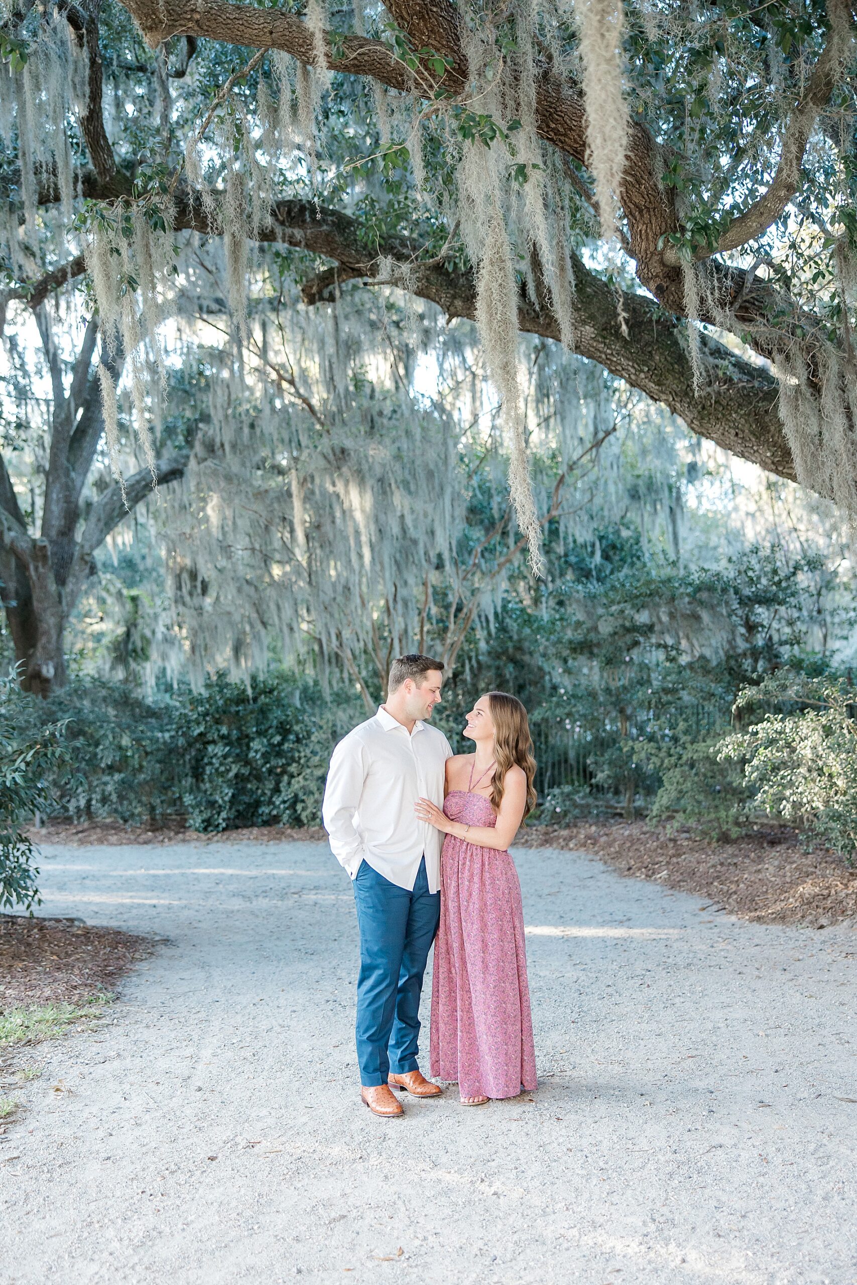 romantic engagement photos under spanish moss covered oak trees in Charleston