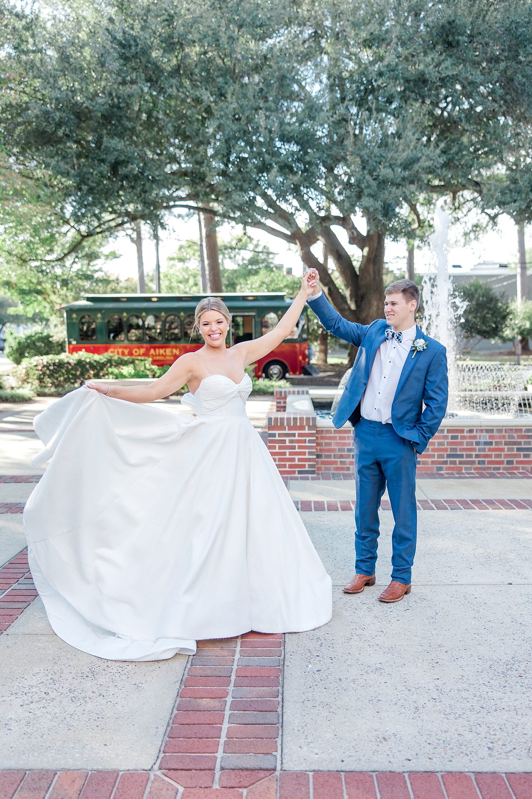 couple dance together during newlywed portraits