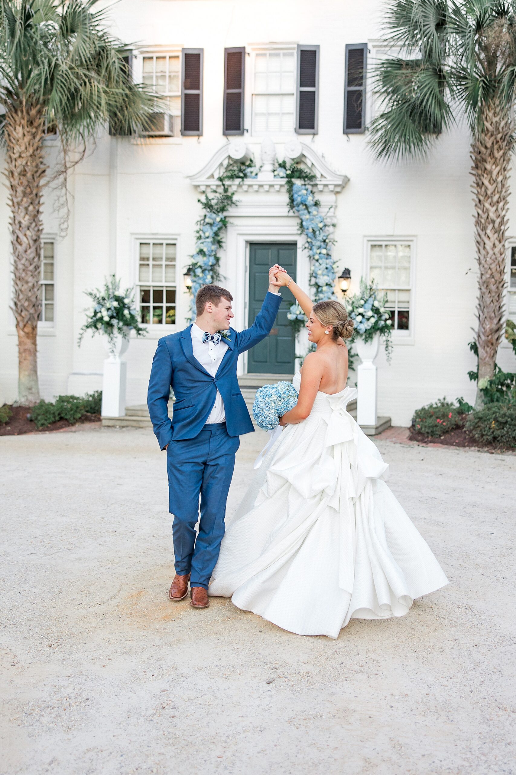 bride and groom dance in front Green Boundary Club in Aiken SC