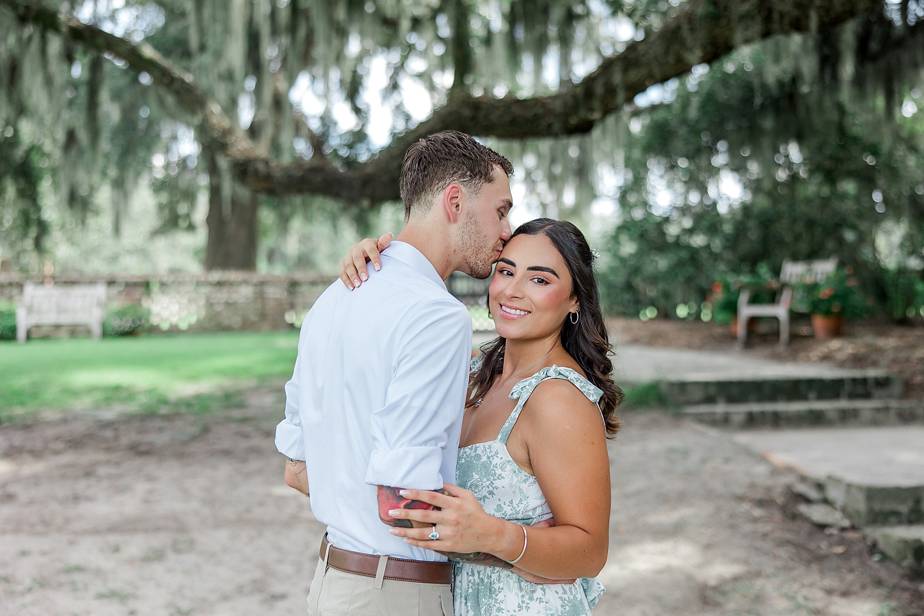 man kisses his fiance